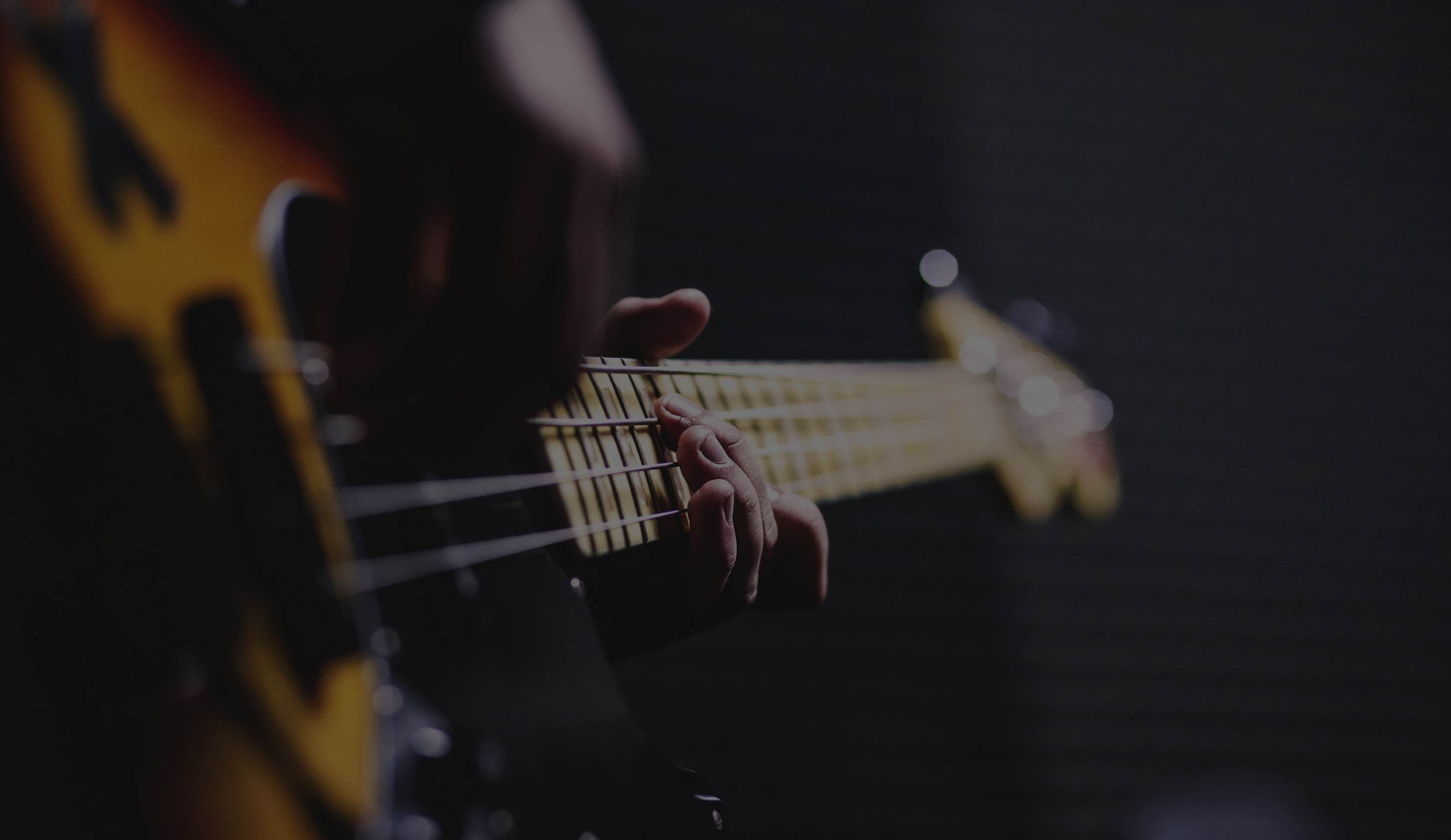 Person playing electric guitar
